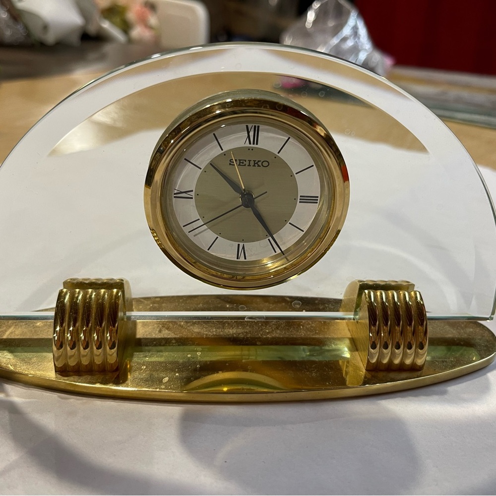 SEIKO table clock in gold and glass.